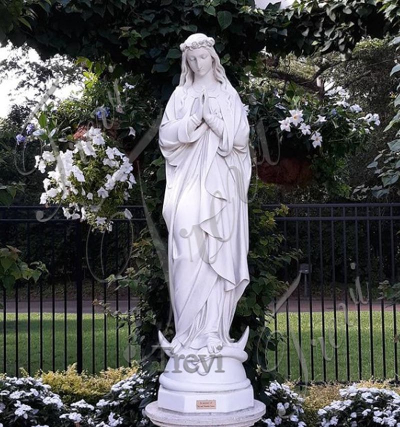 large-outdoor-Mary-statue-in-grotto-on-church-grounds